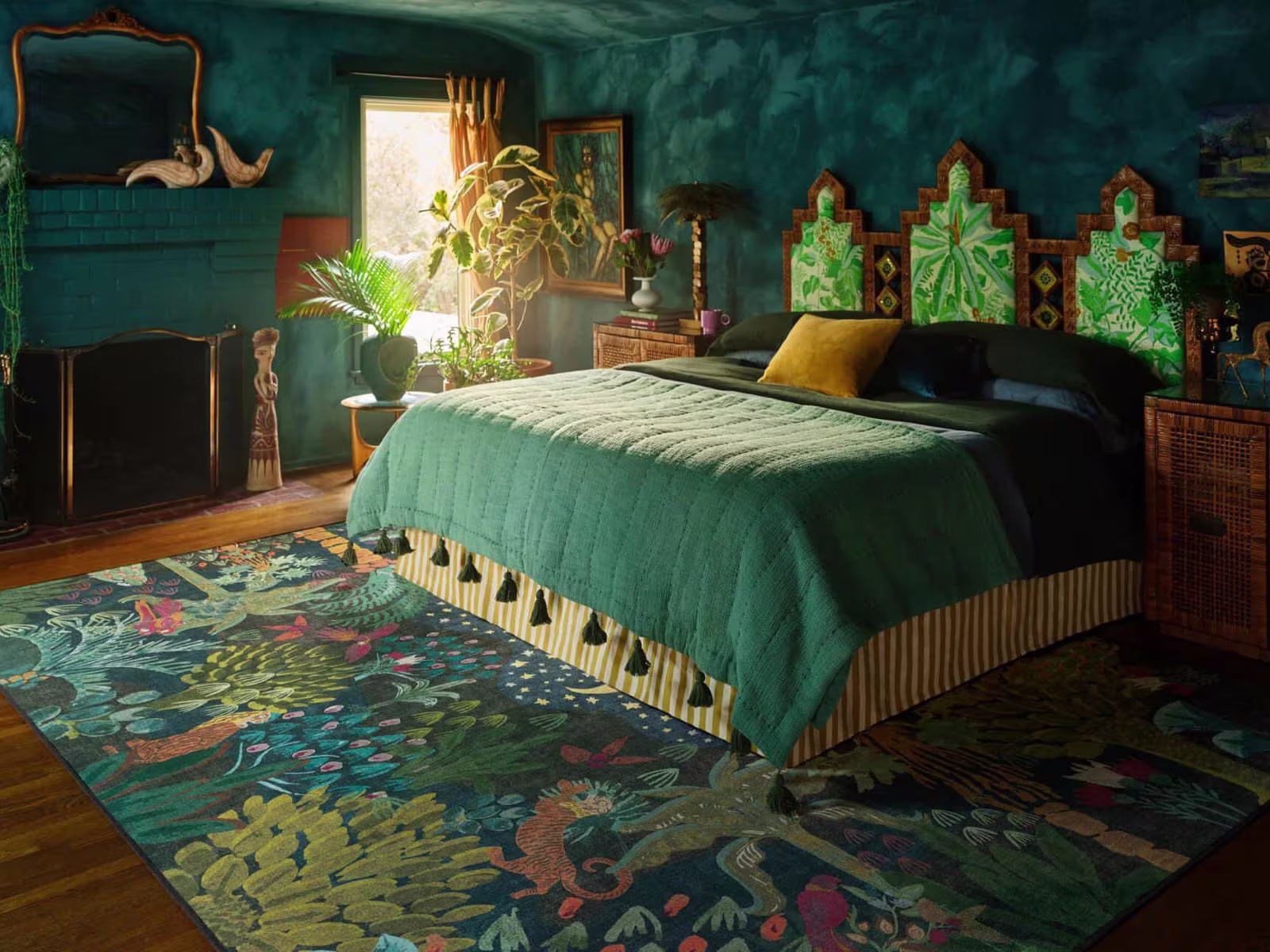 Moody maximalist bedroom featuring textured dark teal walls, plant accents, and the Ruggable x Justina Blakeney Josephine Midnight Rug.