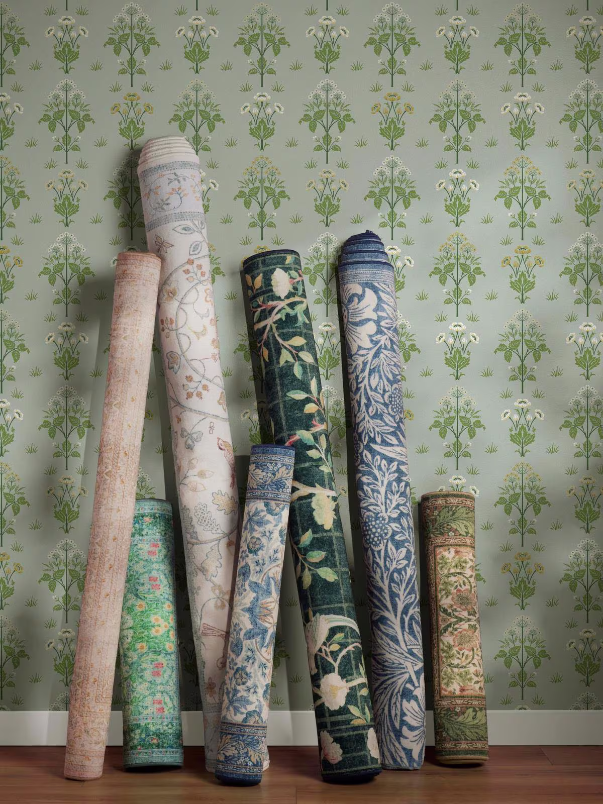 Rolled up rugs from the Ruggable x Morris & Co. Rug Collection of washable designs