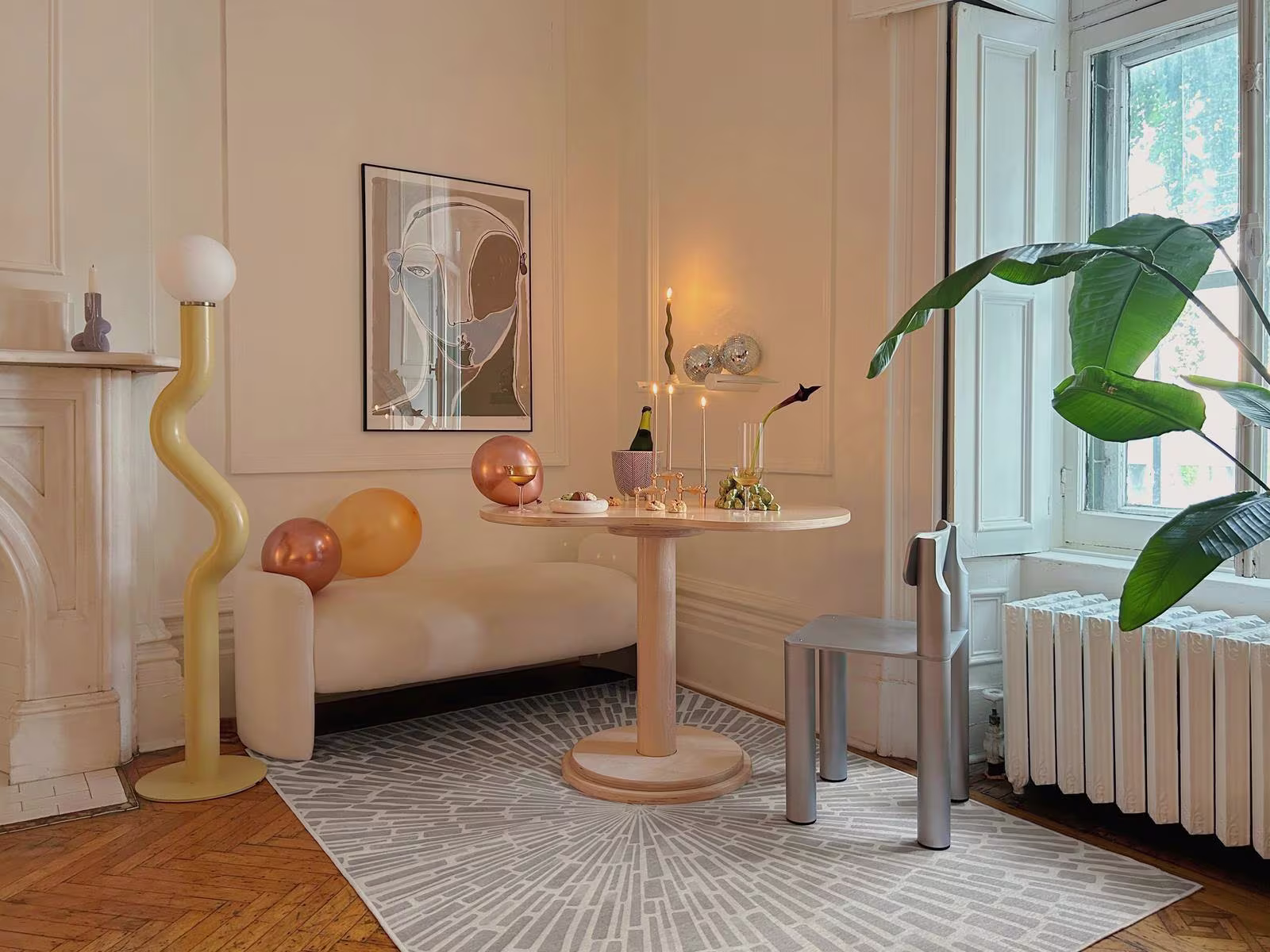 A living room decorated for holidays with our Jonathan Adler Gala Silver Grey Rug, balloons, and candles. 

