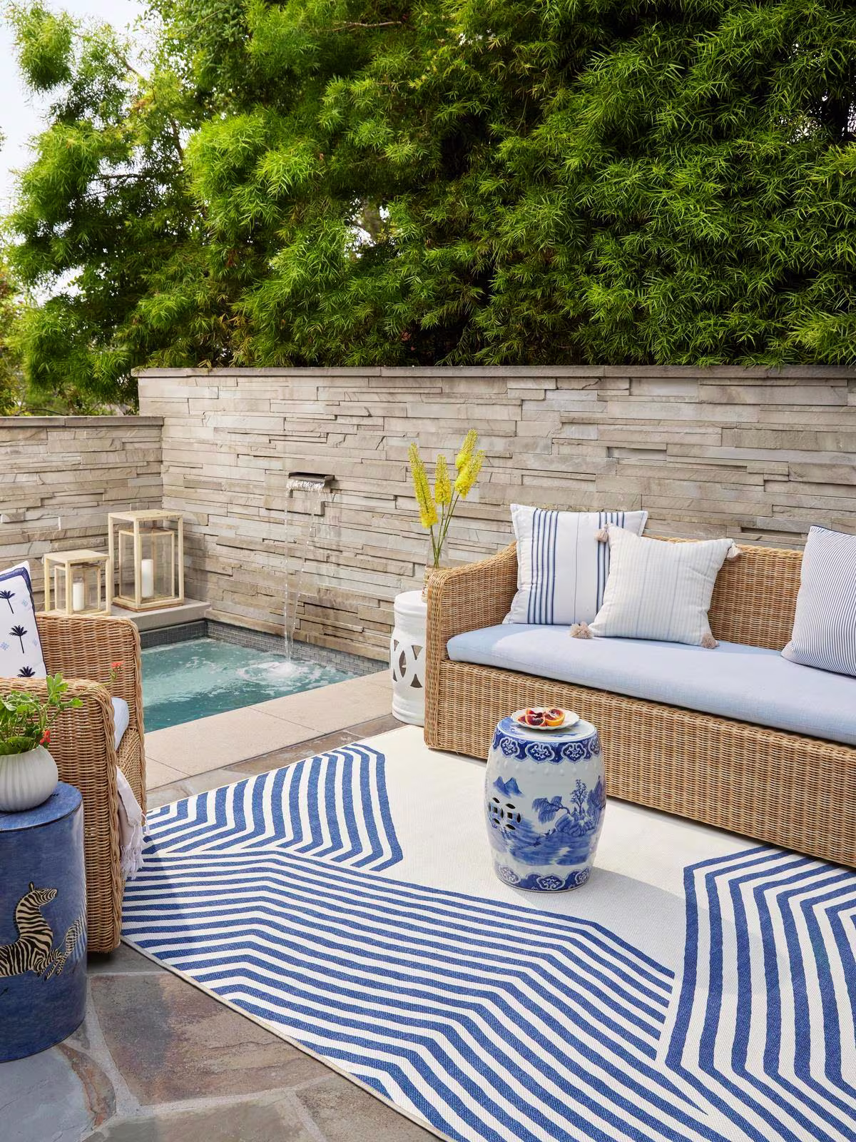 Ruggable x Gray Malin Outdoor Beach Club Navy & Ivory Rug in outdoor setting next to small pool