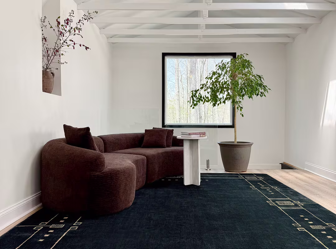 Architectural Digest Avery Midnight Blue Rug with a Brown Sofa