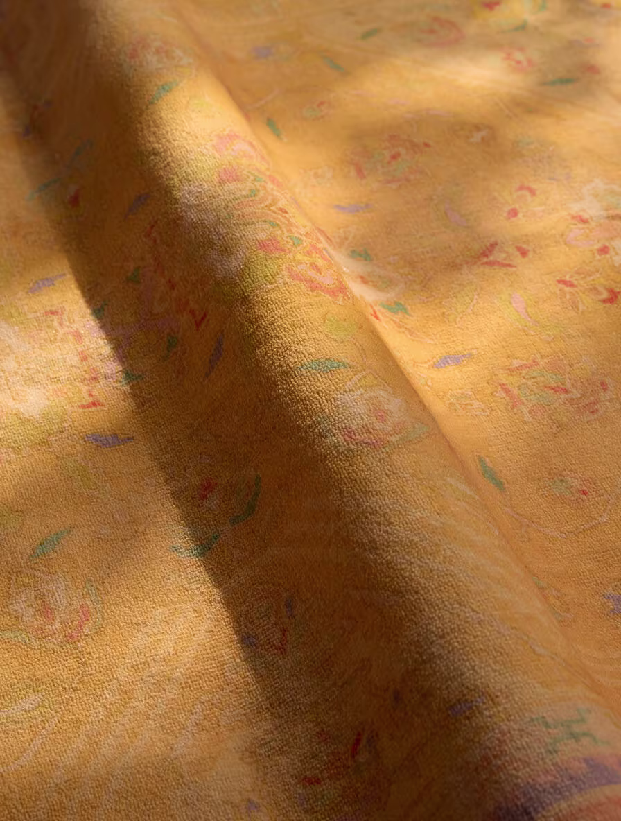 Close-up detail of the Colourful Loom Mango Rug showing textured fibres, highlighting how brushing or steaming can help lift dents.
