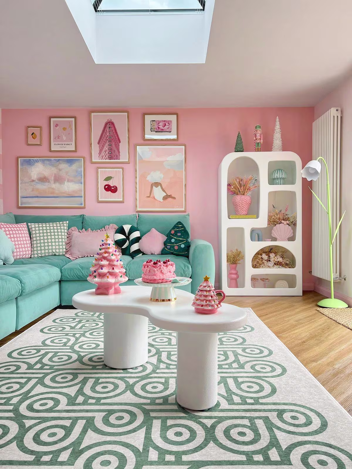 Pink and green holiday living room with washable Ruggable Jonathan Adler Pompidou Jade Rug and mod white furniture