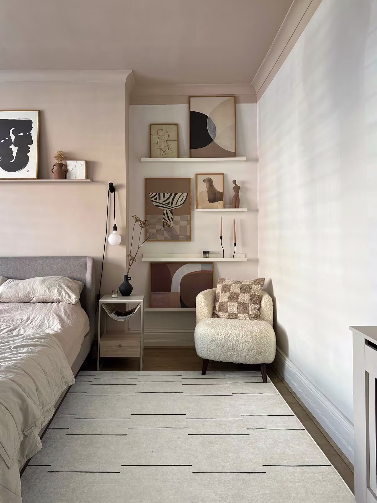 Ruggable washable Laurel Black & Ivory rug in neutral bedroom with sherpa chair and organic modern art