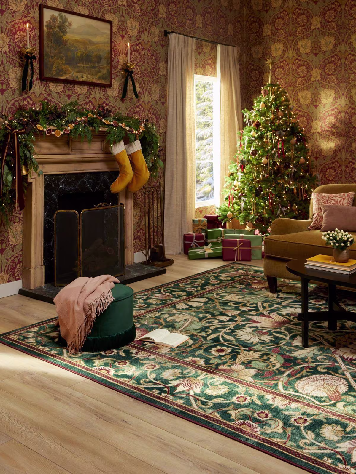 Traditional green and gold holiday living room with Christmas tree, bows, and Ruggable's washable Morris & Co. Lodden Soft Evergreen & Gold Rug