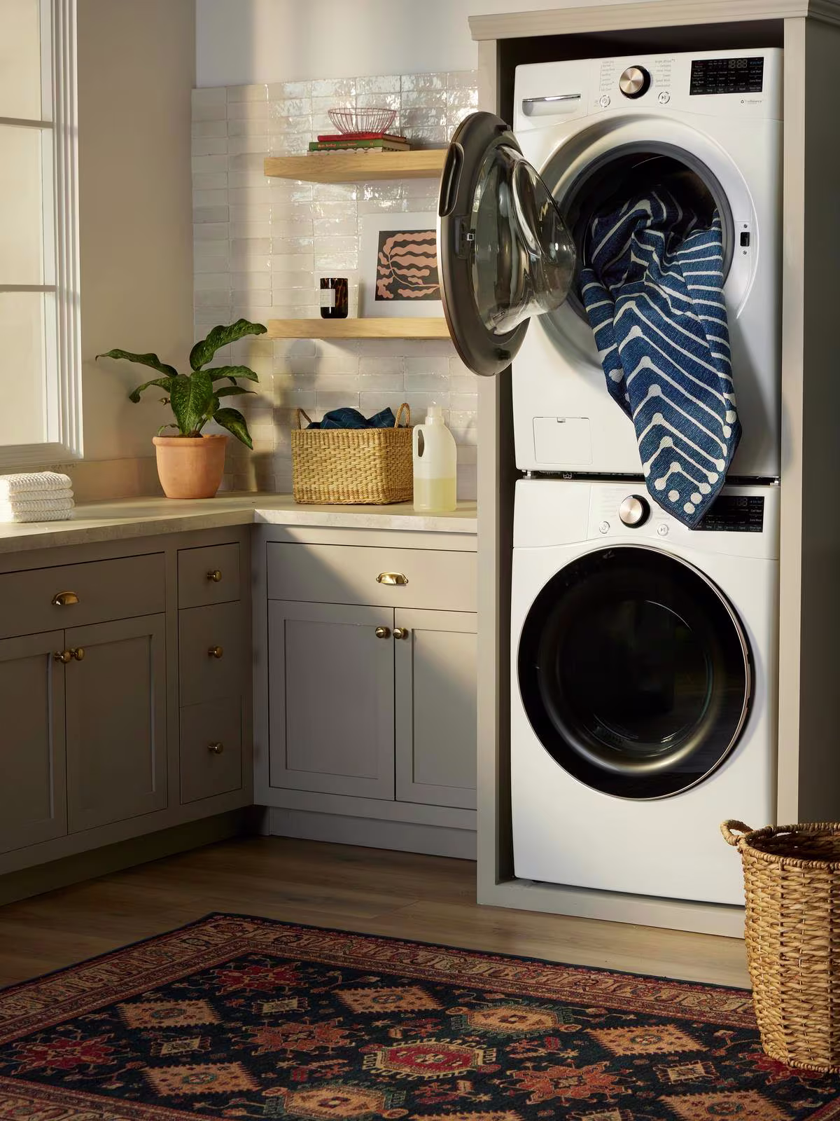 Image of stacked washer and dryer with the Ruggable Jonathan Adler Inkdrop Lapis Blue Rug. 