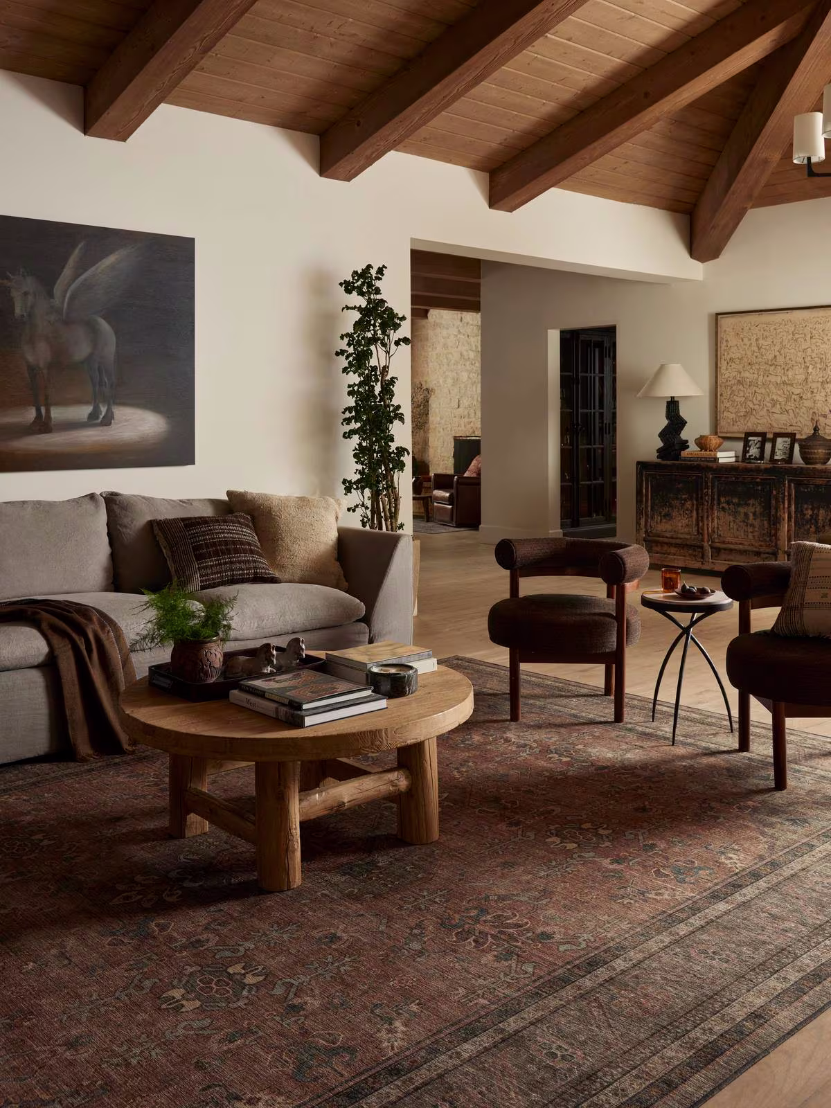 Equestrian transitional living room with washable Ruggable Rowan Stone & Soft Clay rug and organic modern furniture. 