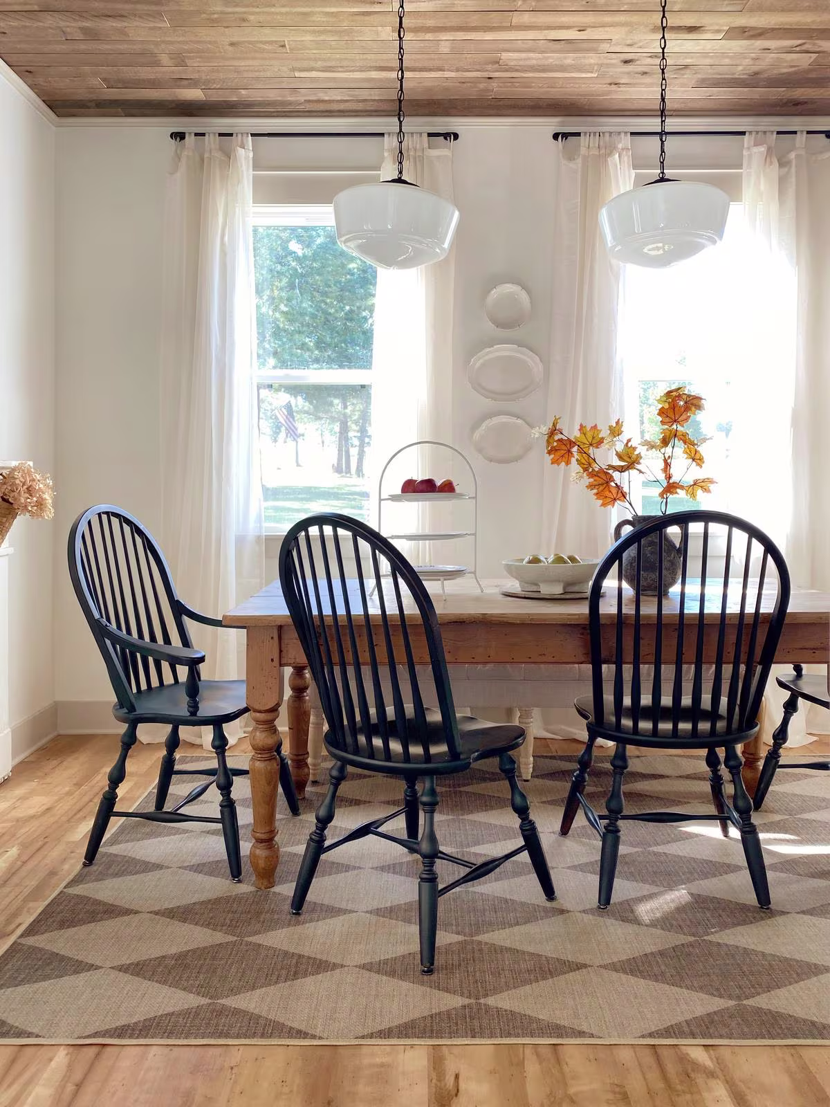 Ruggable Palazzo Latte Brown Re-Jute Rug under kitchen table with fall foliage and milk glass pendants