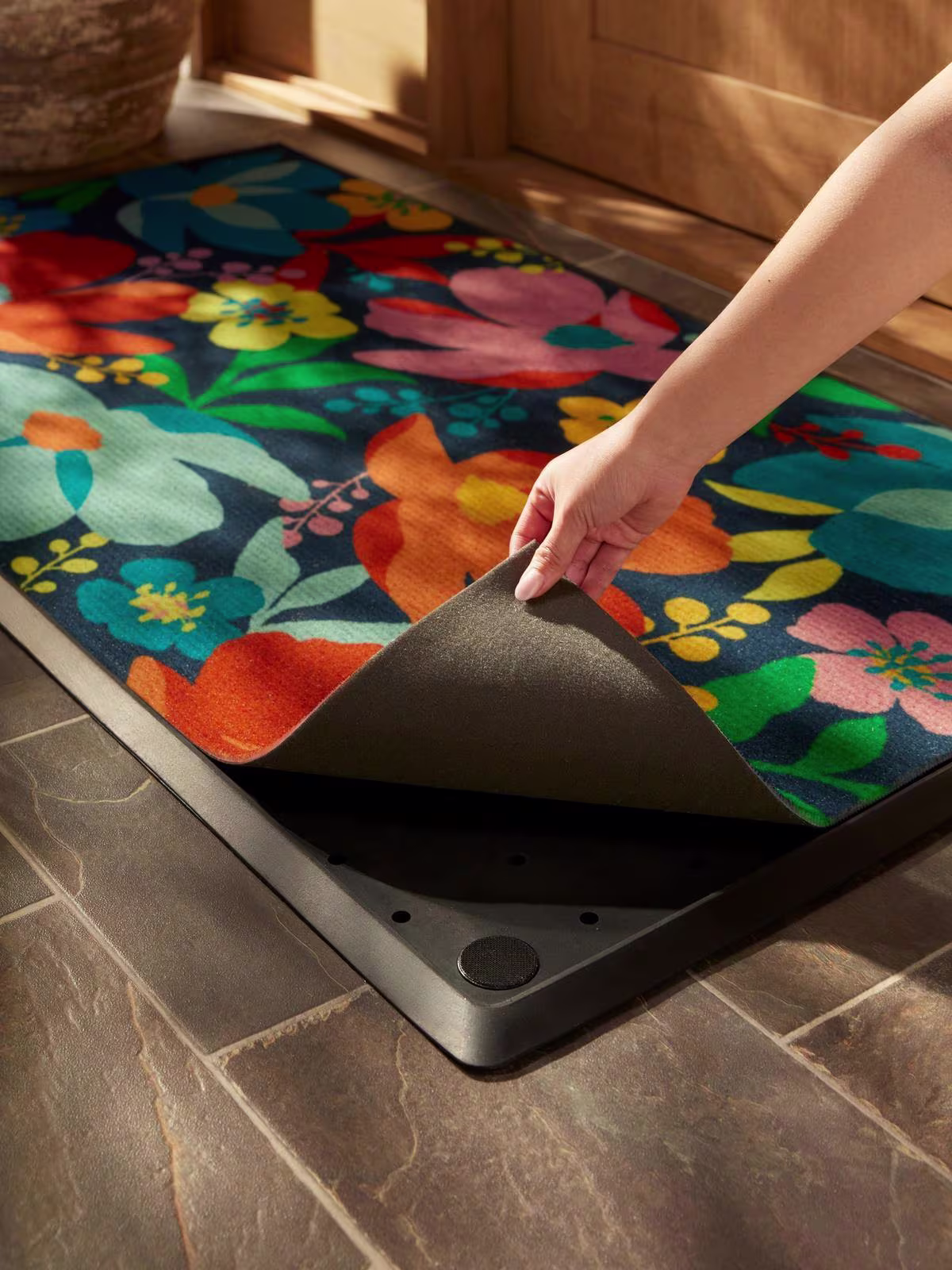 Image of a brick doorstep featuring the Meadow Multicolor Estate Doormat.