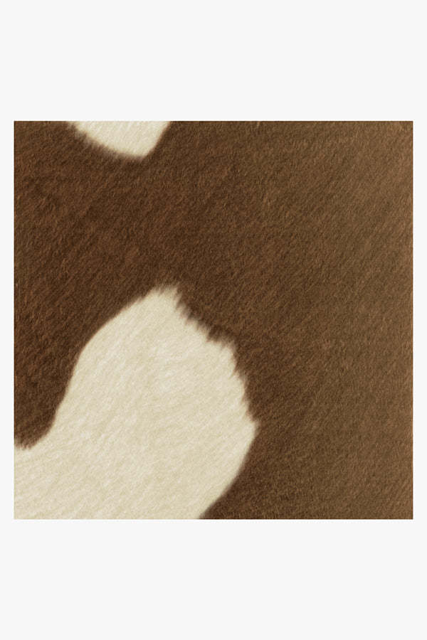 Closeup of Ruggable's Tan & Ivory Faux Cowhide Rug