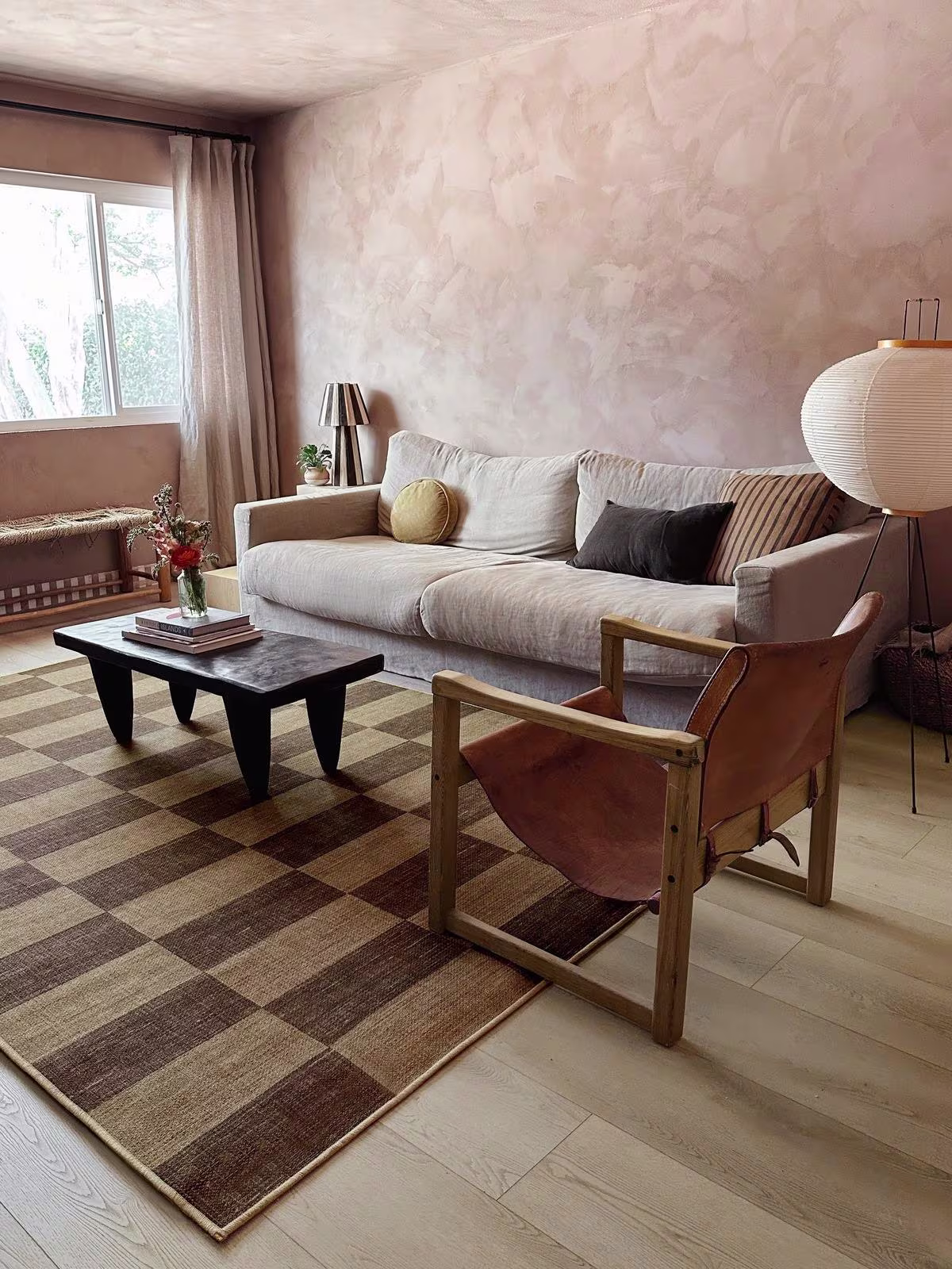 Organic modern living room with Ruggable x Architectural Digest Yates Check Brown Re-Jute rug and vintage furniture 