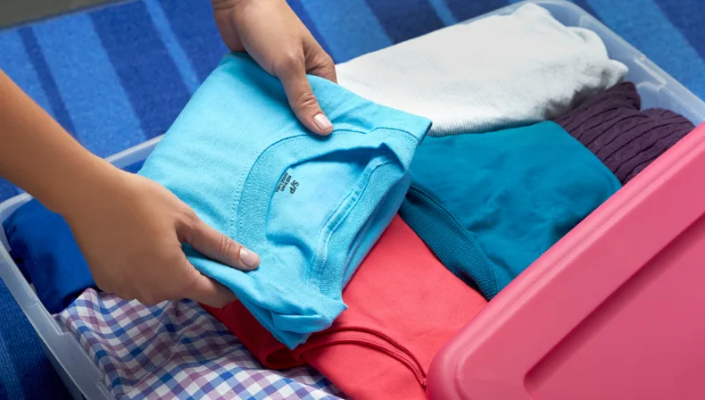 Fold sweaters and T-shirts flat to help them hold their shape longer