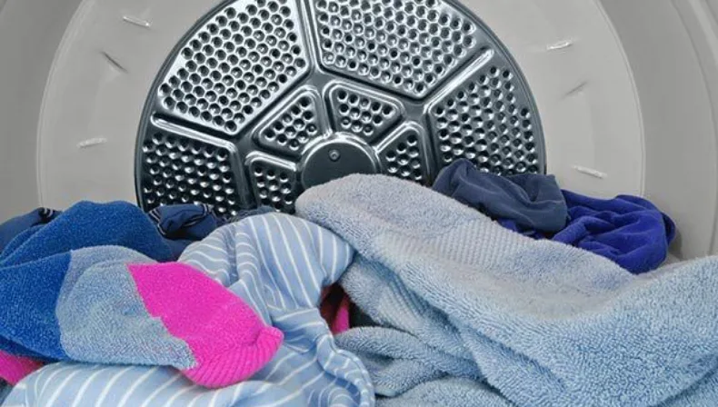 Avoid wrinkles by catching dryer as soon as it dings