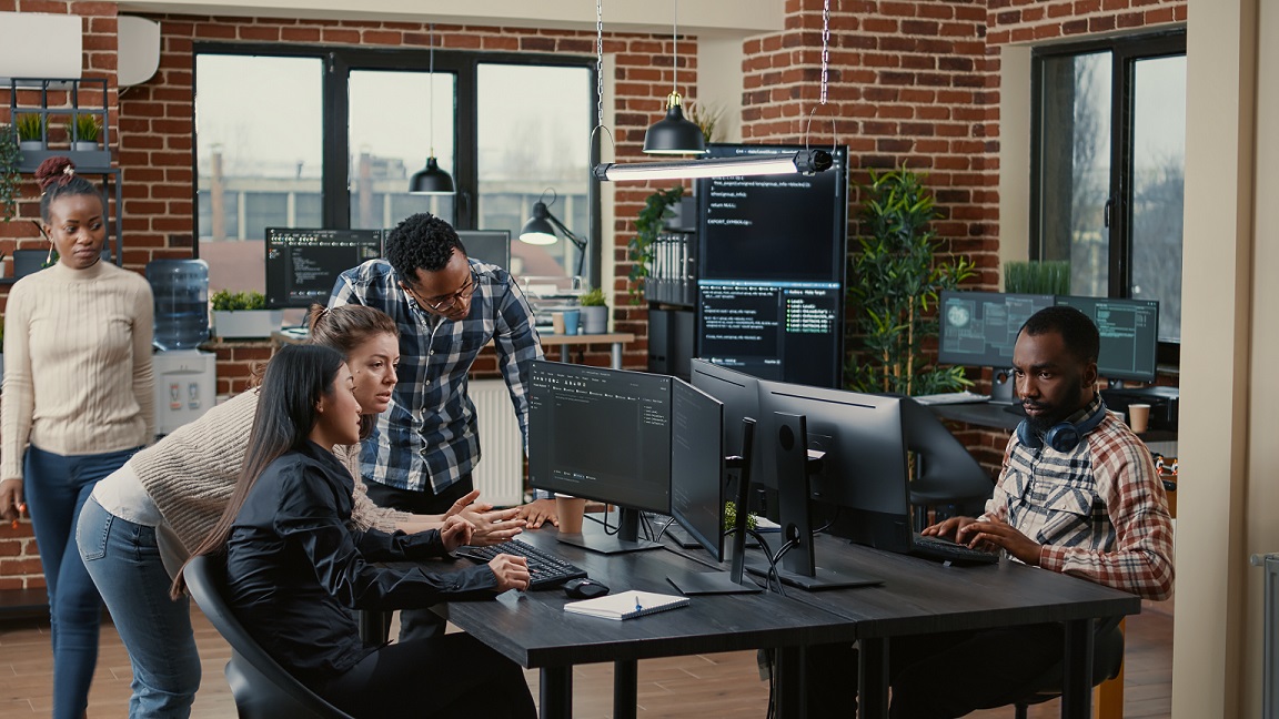 a couple of colleagues in the office working together