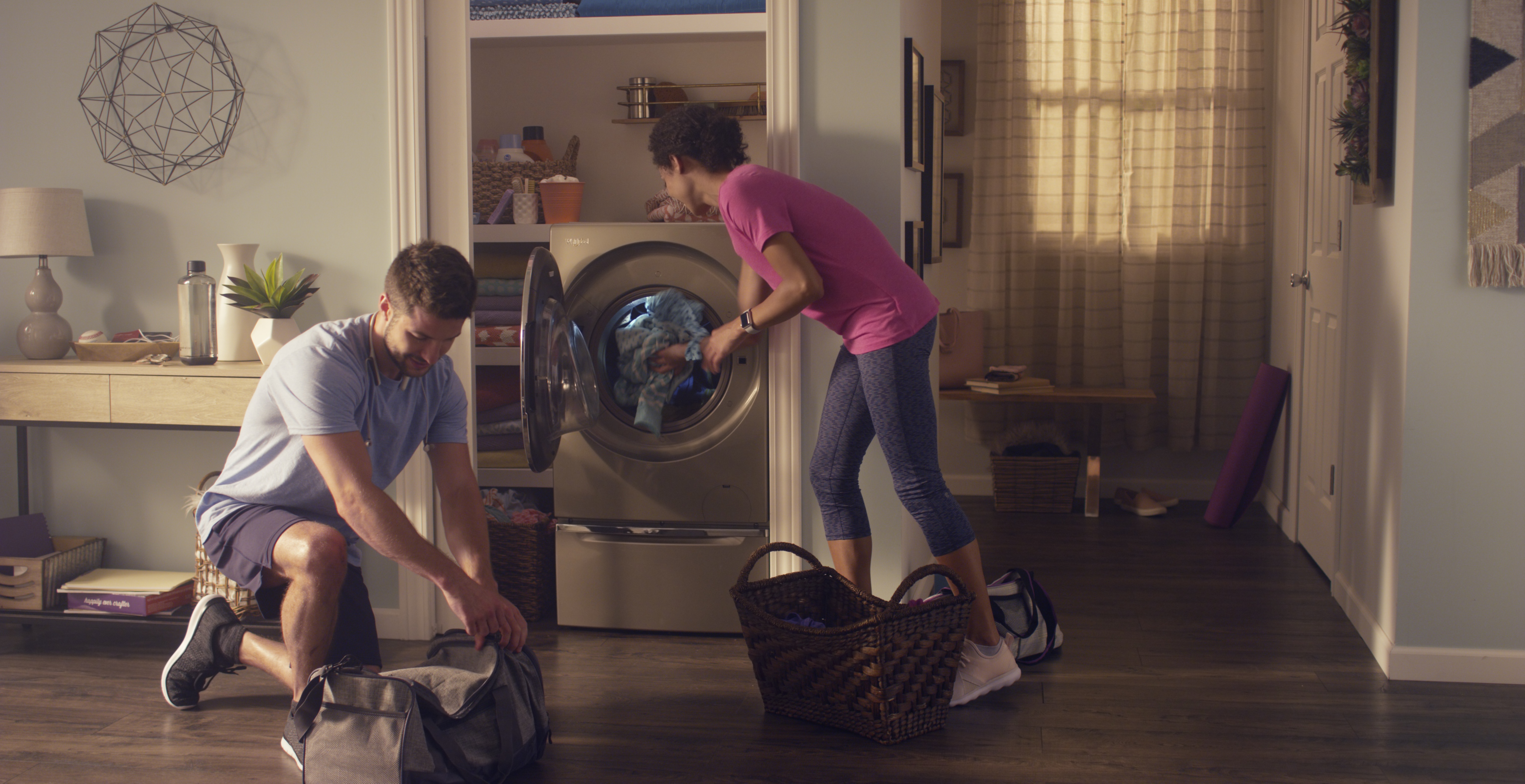 Two people doing laundry -- from Whirlpool collection
