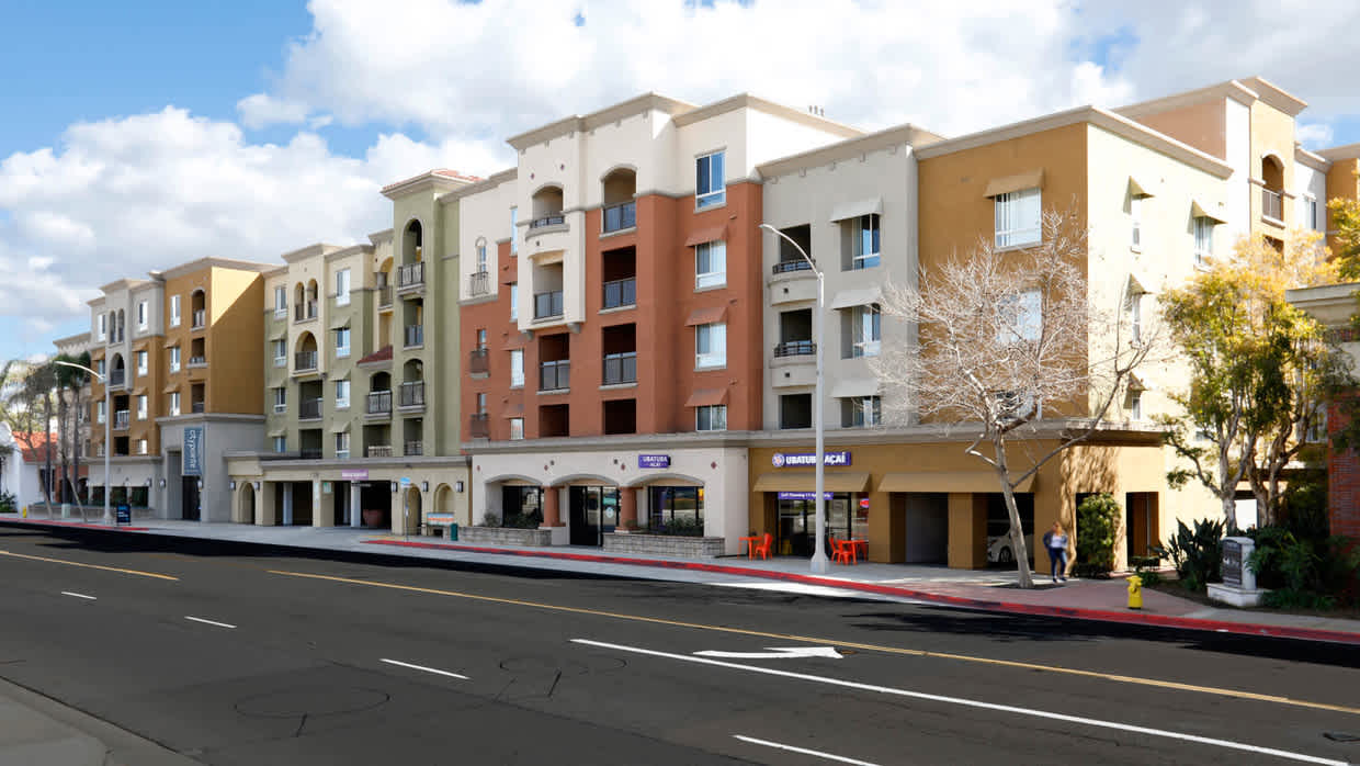 Mixed-use multifamily development in downtown Fullerton showcasing successful land assembly and public-private partnership by John Favreau.