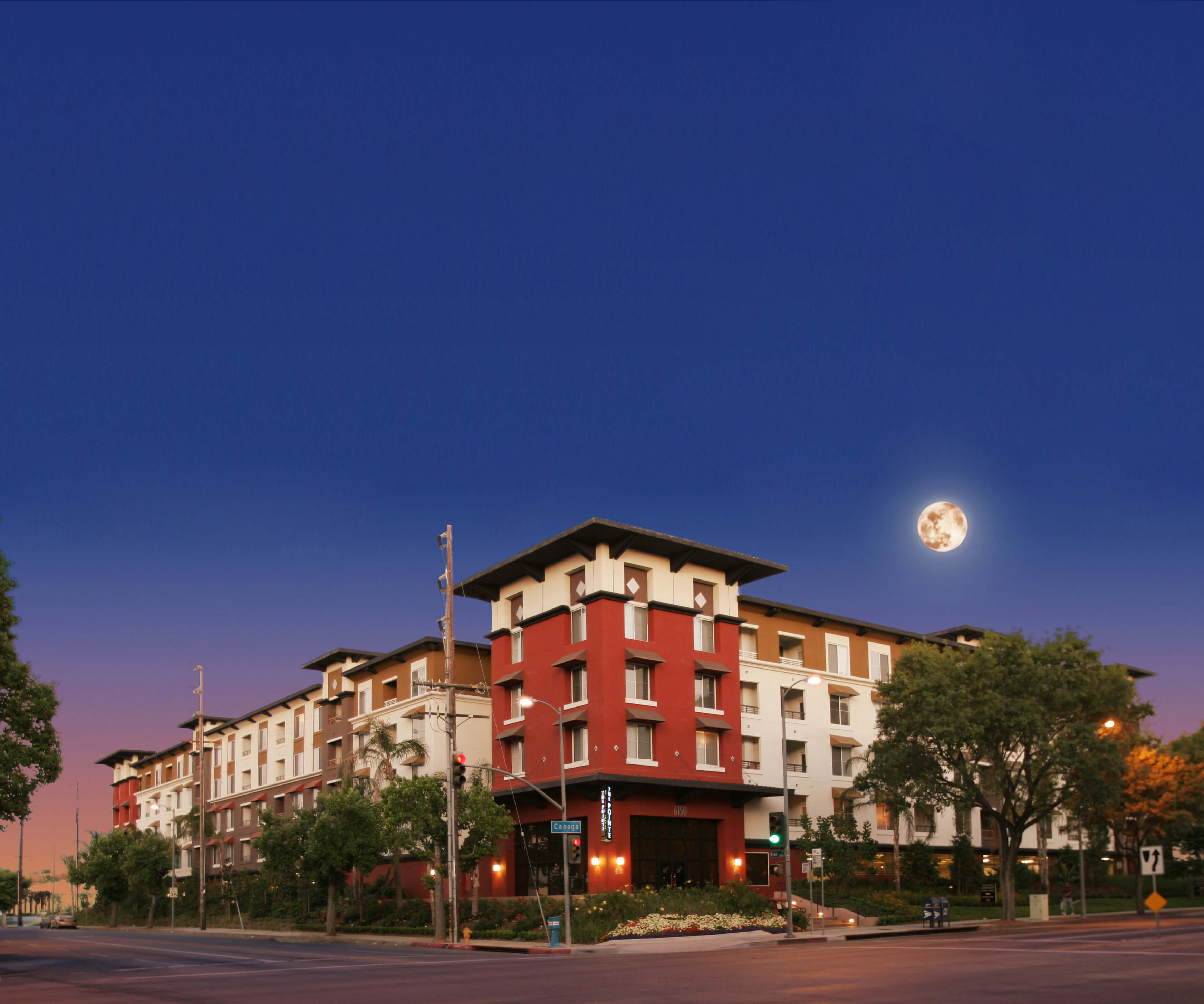 Mid-rise multifamily community in Los Angeles with vibrant façade colors, corner frontage, and a walkable layout ideal for urban residential density.