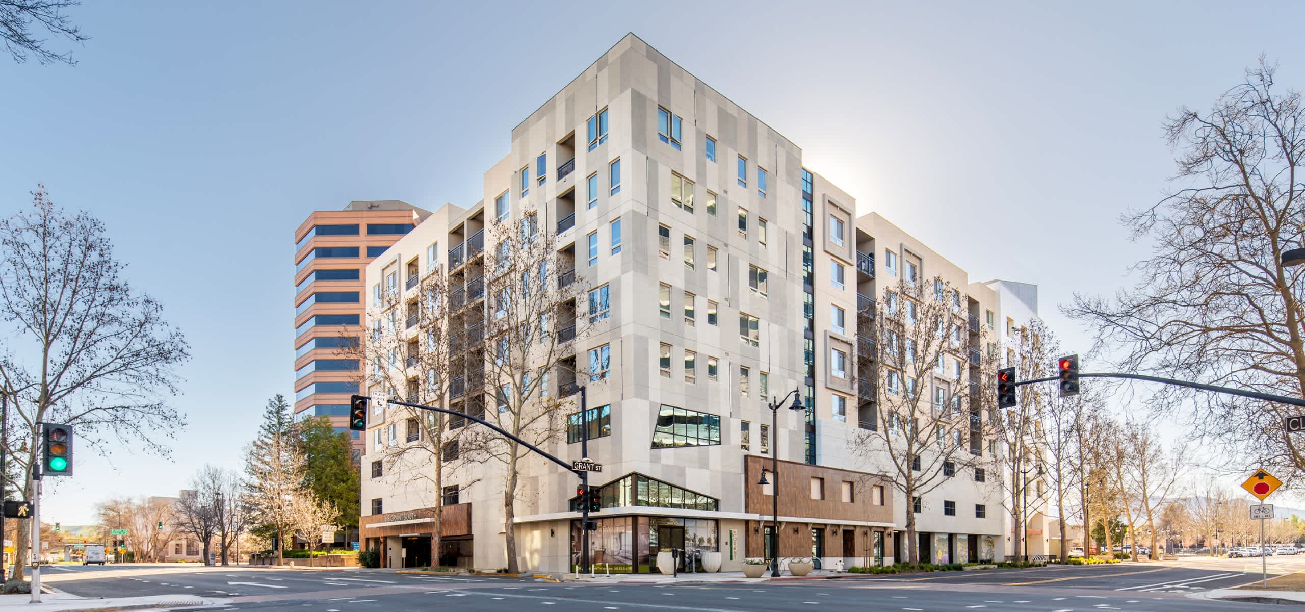 Daytime corner view of The Grant in downtown Concord—an urban infill multifamily project redesigned for financial viability and long-term leasing.