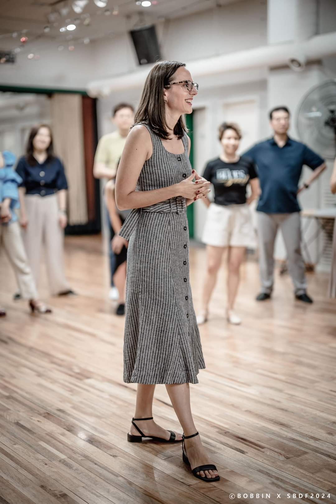 Kelsy Stone teaching a workshop at a dance event.