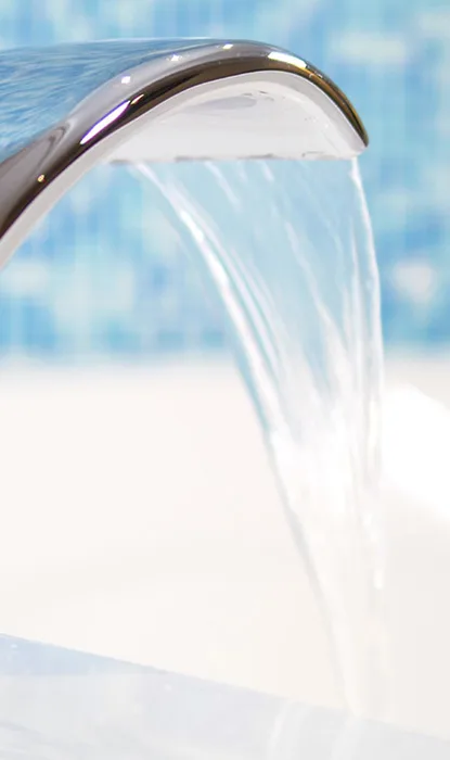 Water running on a fancy bathtub faucet
