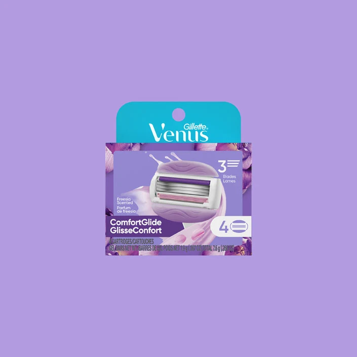 Venus ComfortGlide Freesia Scented refill packaging with 4 cartridges, 3 blades, and gel bars