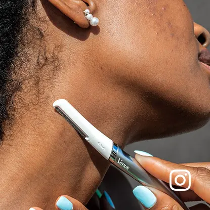Woman shaving the back of her neck with a Gillette Venus facial razor for precise hair removal