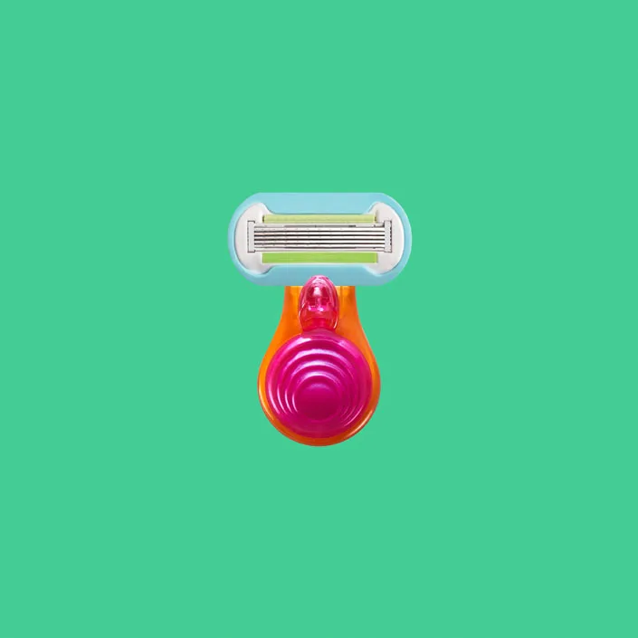 Gillette Venus Extra Smooth Mini razor with compact handle and five blade cartridge