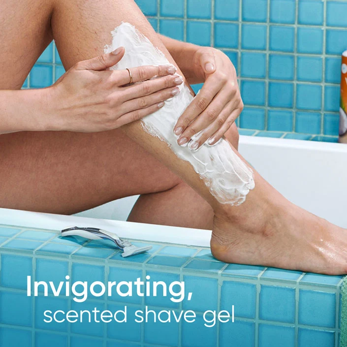 Woman creamed her leg with invigorating and scented shave gel