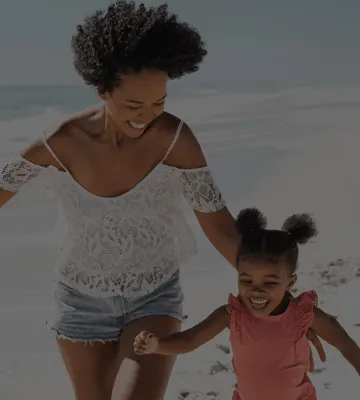 Mom and daughter on the beach