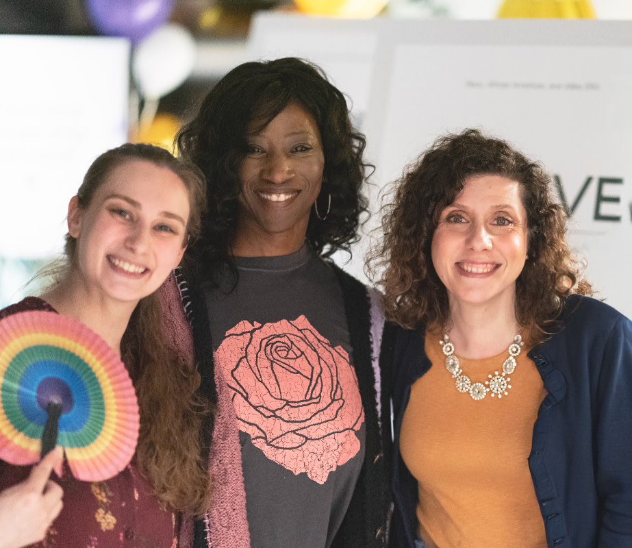 Colleagues stand together smiling at Commonwealth's employee resource group launch party