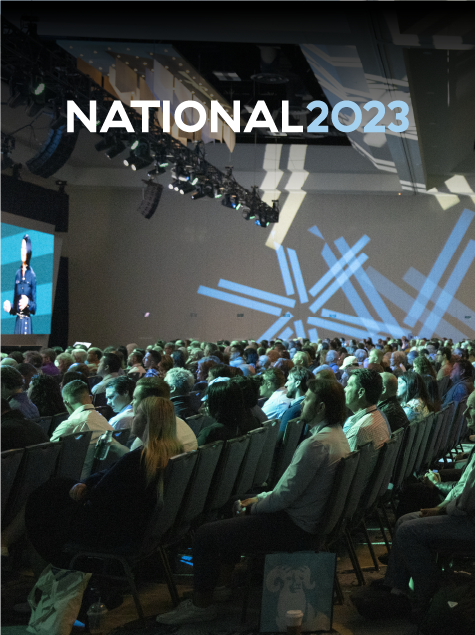 Conference attendees seated in a full session room at National 2023