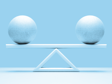 One ball on both ends of a scale showing equal weight