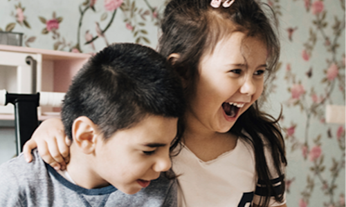 two joyful children whose family may benefit from special needs planning