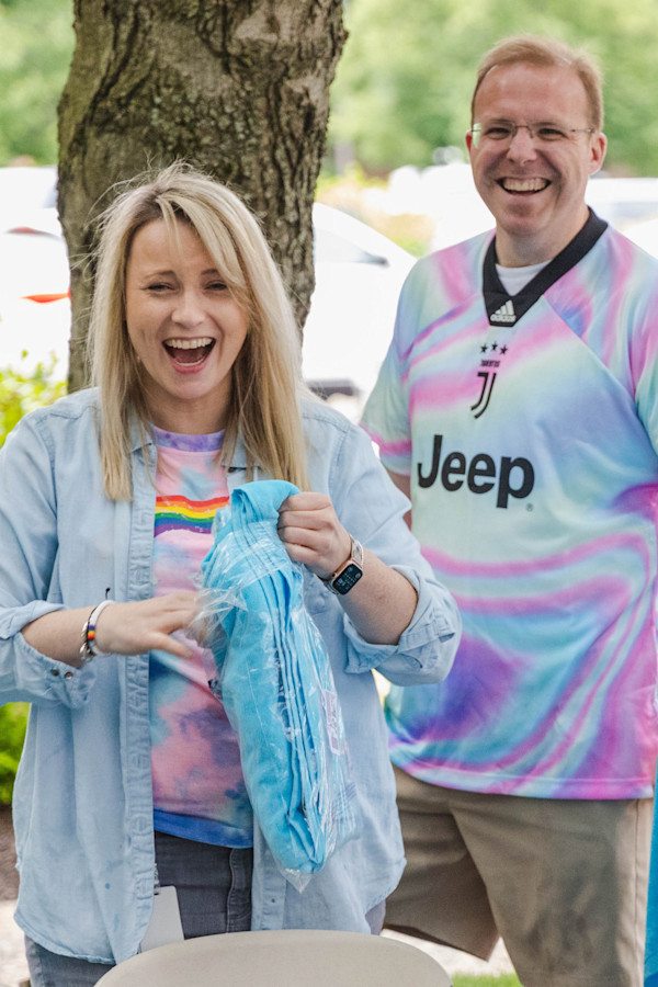 Two Commonwealth employees celebrate at our annual Pride Block Party.