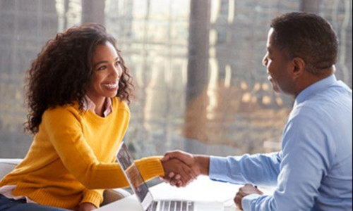 Man and woman sitting together having a meeting.