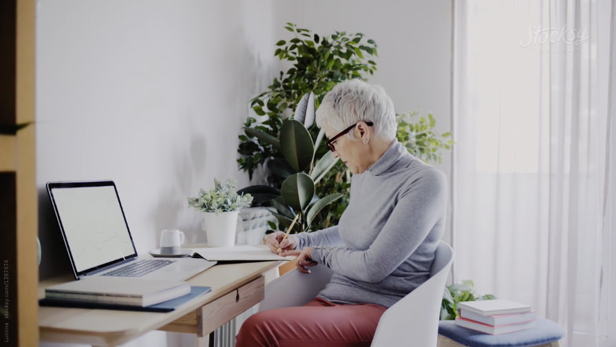 Woman sitting at a desk.