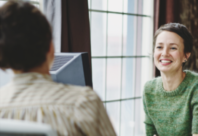 a young woman smiling during an interview