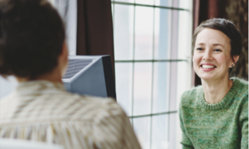 a young woman smiling during an interview