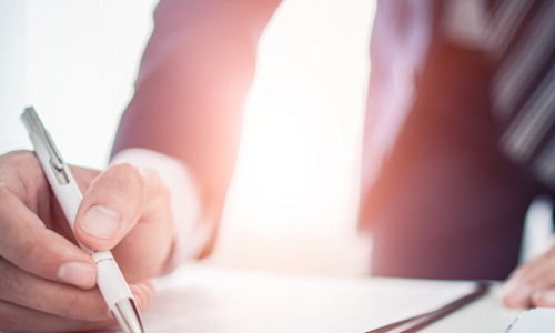 An advisor reviews a year-end financial checklist with a client.