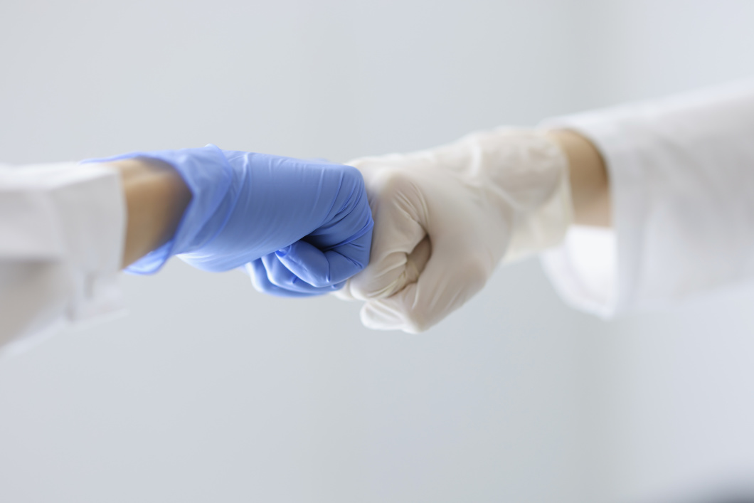 Laboratory worker fist bumb