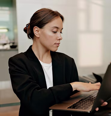 Female developer with laptop in hands