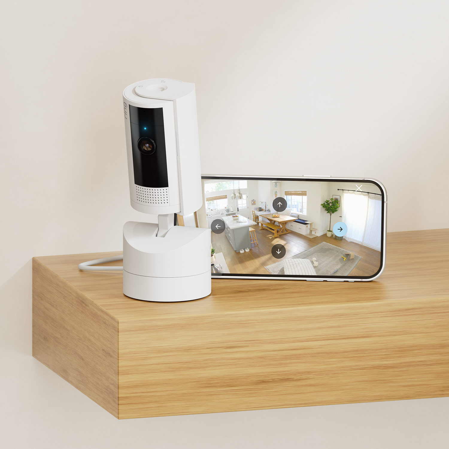 Pan-Tilt Indoor Cam  - Ring camera with iPhone that displays surveillance video on wooden shelf for Pan-Tilt Indoor Cam.