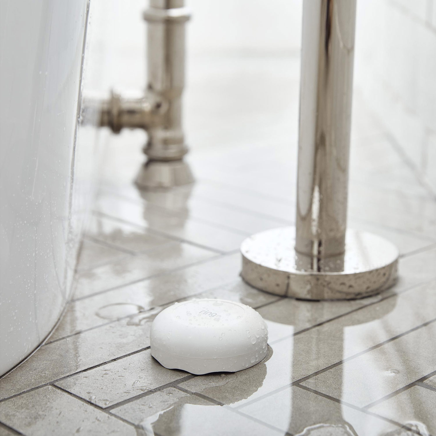 Inside Home Deluxe Kit (Pan-Tilt Indoor Cam, 2-Pack + Alarm Security Kit, 8-Piece + Alarm Flood & Freeze Sensor + Alarm Smoke and CO Listener) - Alarm Flood & Freeze Sensor on tile flooring.
