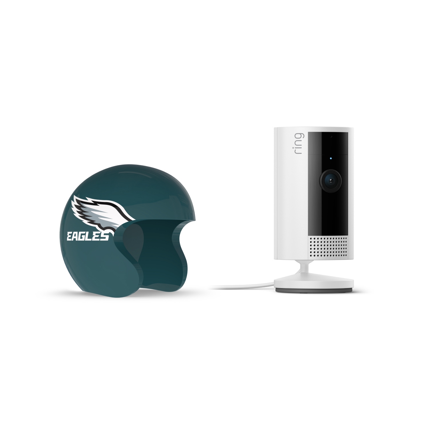 Indoor Cam, White + NFL Game Day Cam Cover — NFC - White Ring indoor camera on a stand next to a dark green mini helmet with the Eagles wing logo on a white background.