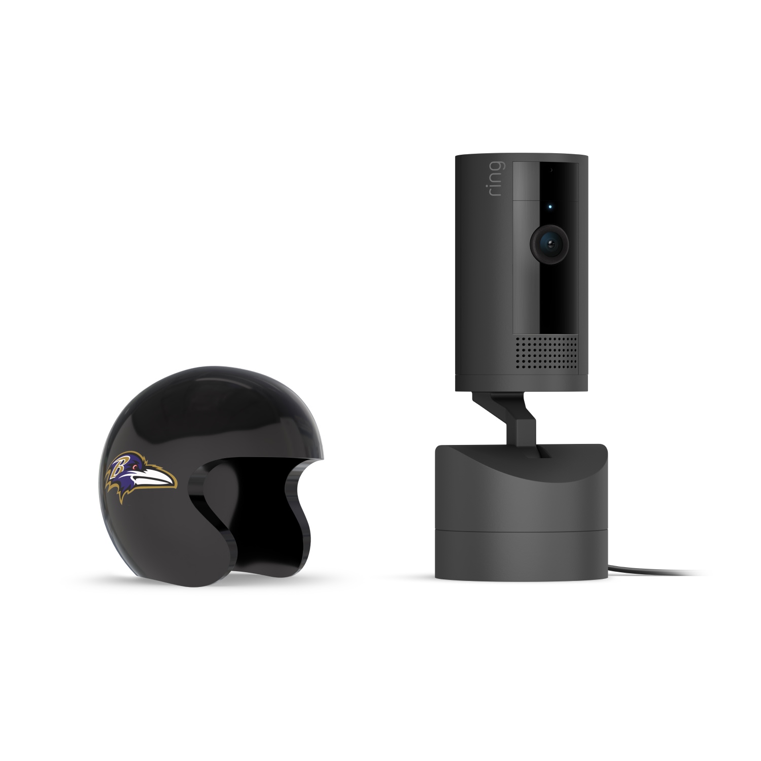 Pan-Tilt Indoor Cam, Black + NFL Game Day Cam Cover — AFC - Black Ring indoor camera on a charging base beside a glossy black mini helmet with a purple raven logo on a white background.