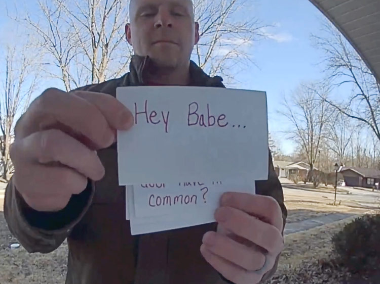 Video captured on a video doorbell of a man shuffling flash cards that together read: 