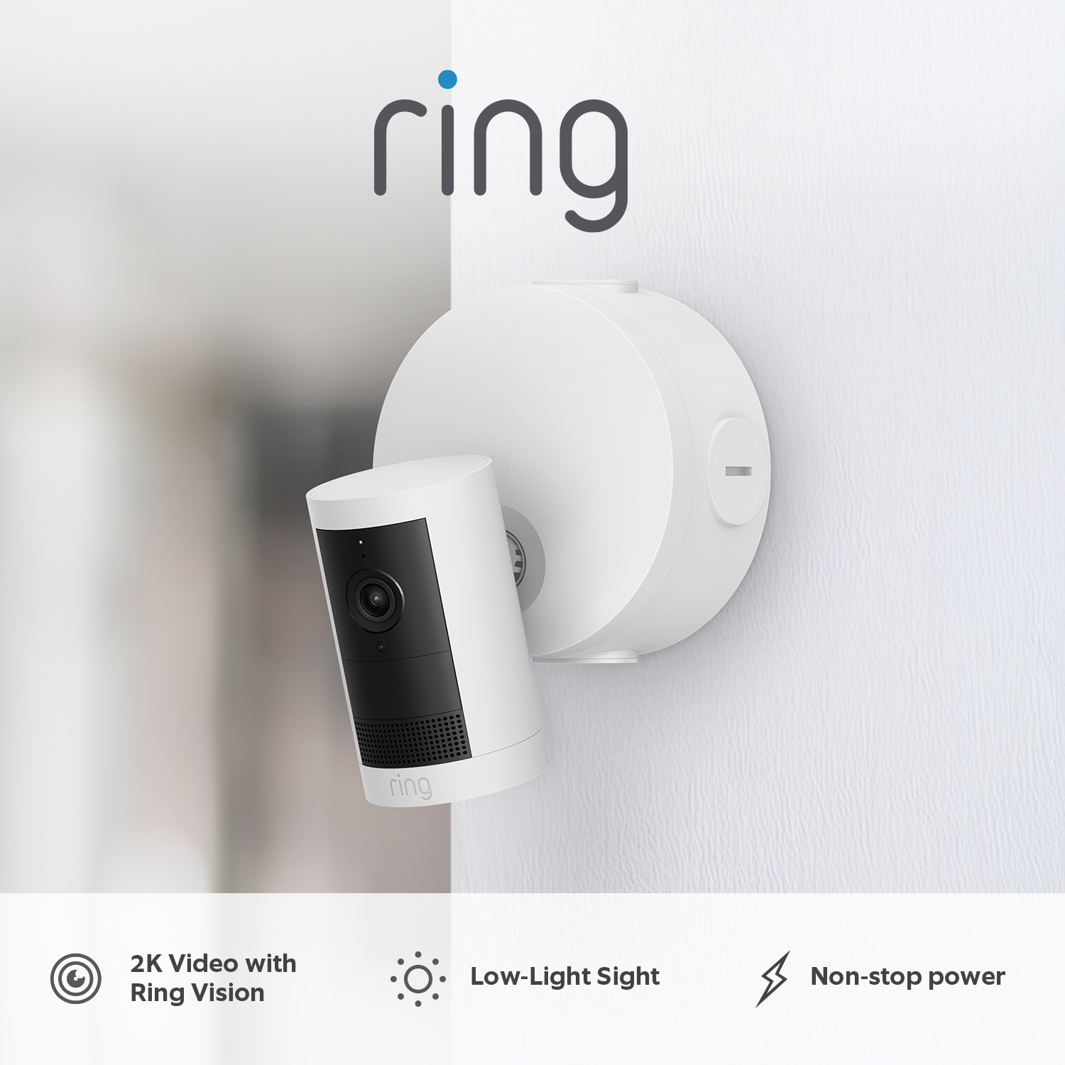 Outdoor Camera Plus (Featuring 2K Video with Ring Vision) - Power over Ethernet:White Outdoor Camera mounted to wooden wall on a rainy day