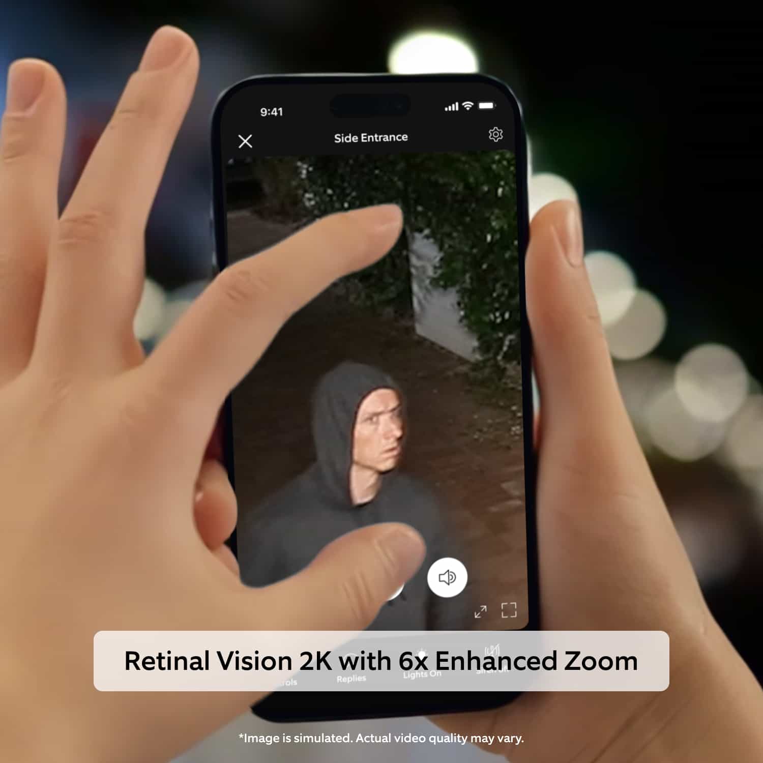 Spotlight Cam (Newest Model) - Hands holding a smartphone at night, zooming into security app footage of a hooded person near a side entrance.