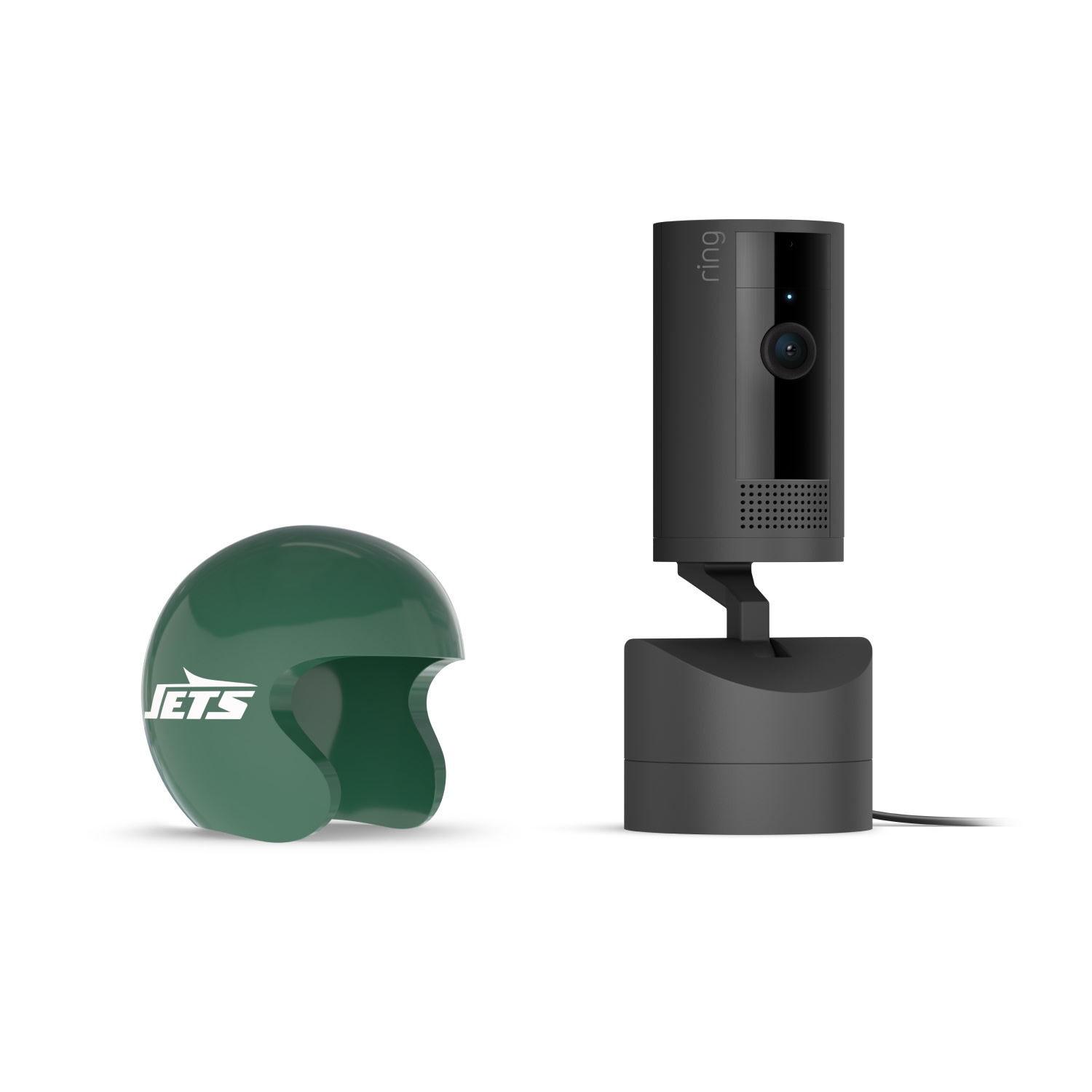 Pan-Tilt Indoor Cam, Black + NFL Game Day Cam Cover — AFC - Black Ring indoor camera on a charging base next to a small green New York Jets mini helmet on a white background.