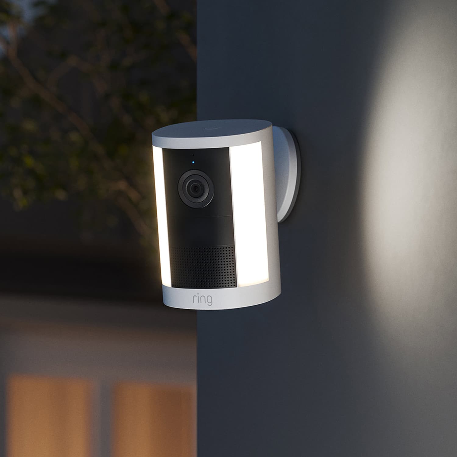Spotlight Cam (Newest Model) - Battery:Spotlight Cam (2nd Gen) mounted on a wall at dusk.
